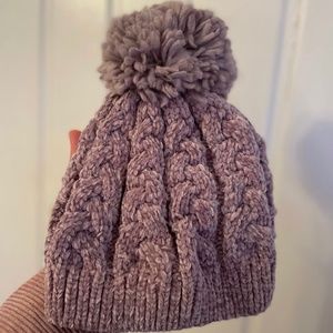 Purple hat with pom